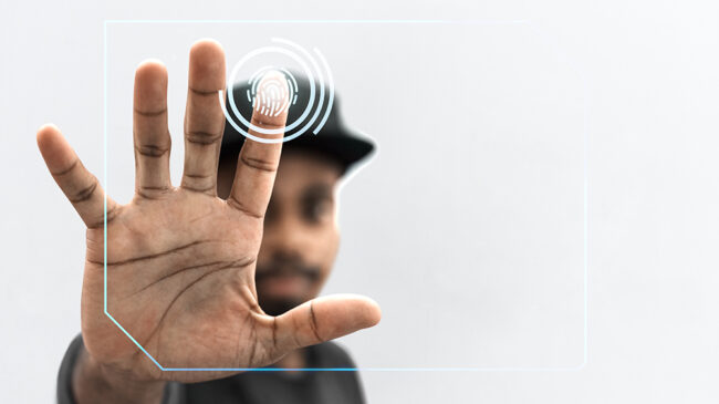 Black man scanning his finger
